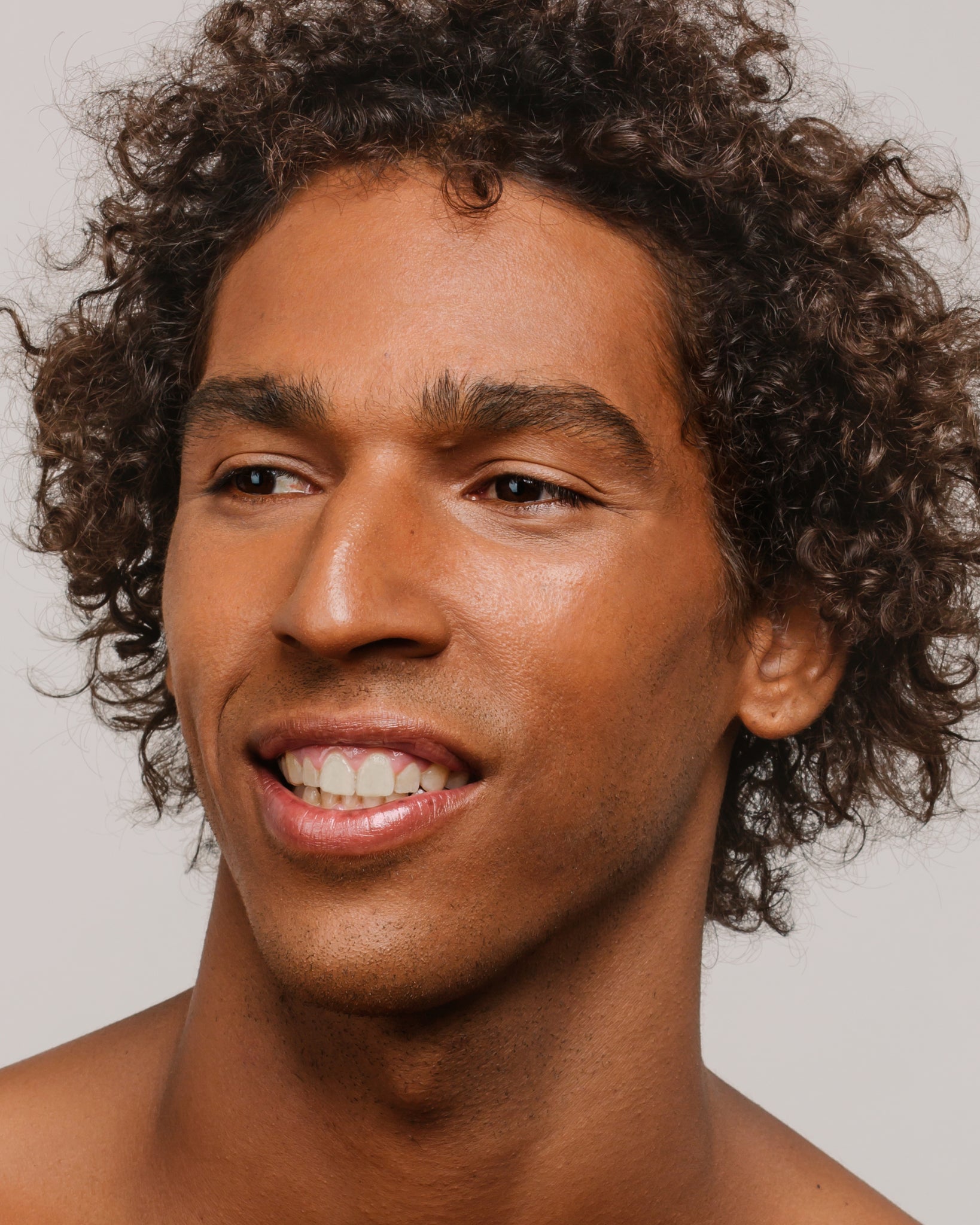 Model wearing MÁDARA Organic Skincare skin equal fudge on A6065 on skin; close-up portrait shows natural application results.