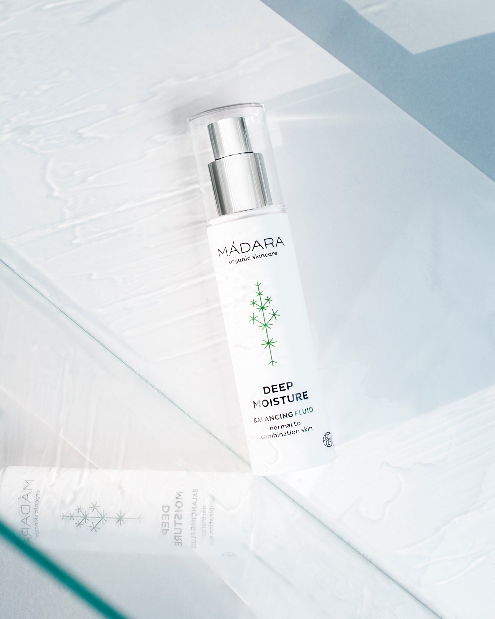 MÁDARA Organic Skincare balancing fluid A2211 product photo on plain background.