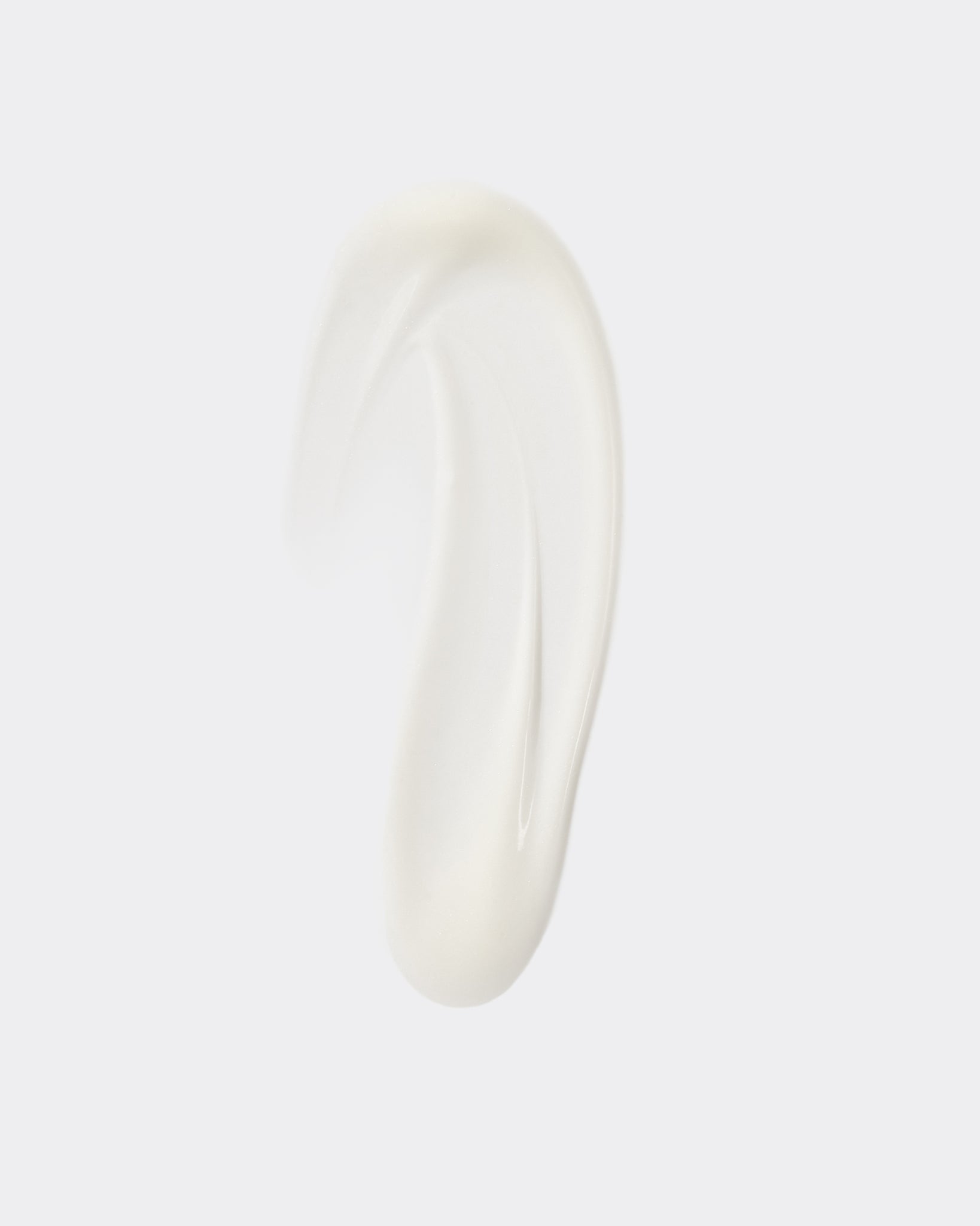 Texture close-up of MÁDARA Organic Skincare hydrating fluid A2211 �swatch demonstrates consistency and finish.