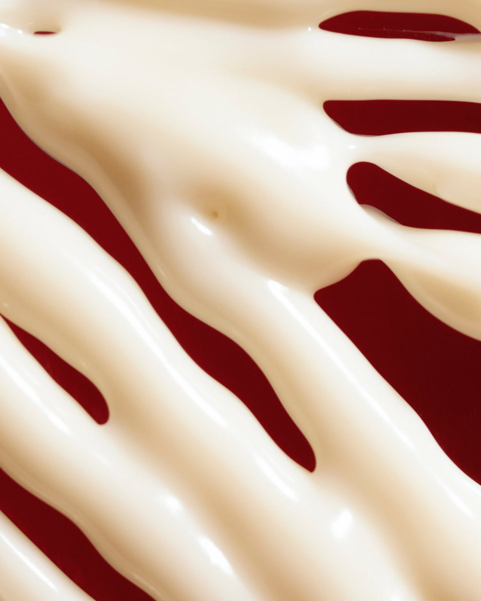 Texture close-up of MÁDARA Organic Skincare hydra silk firming cream A3051 face cream �swatch demonstrates consistency and finish