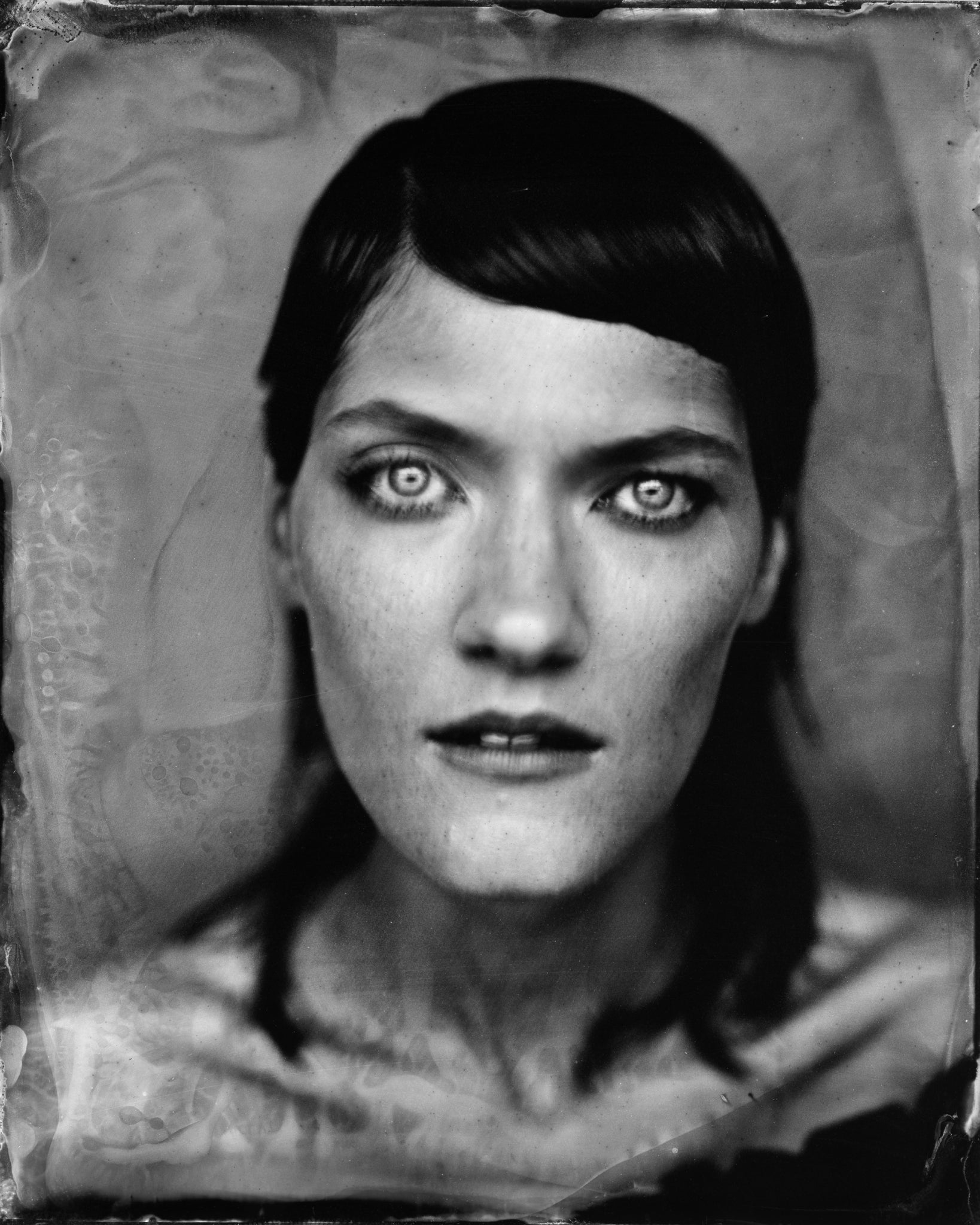 Model wearing MÁDARA Organic Skincare vegan mascara on A6601 on skin; close-up portrait shows natural application results.