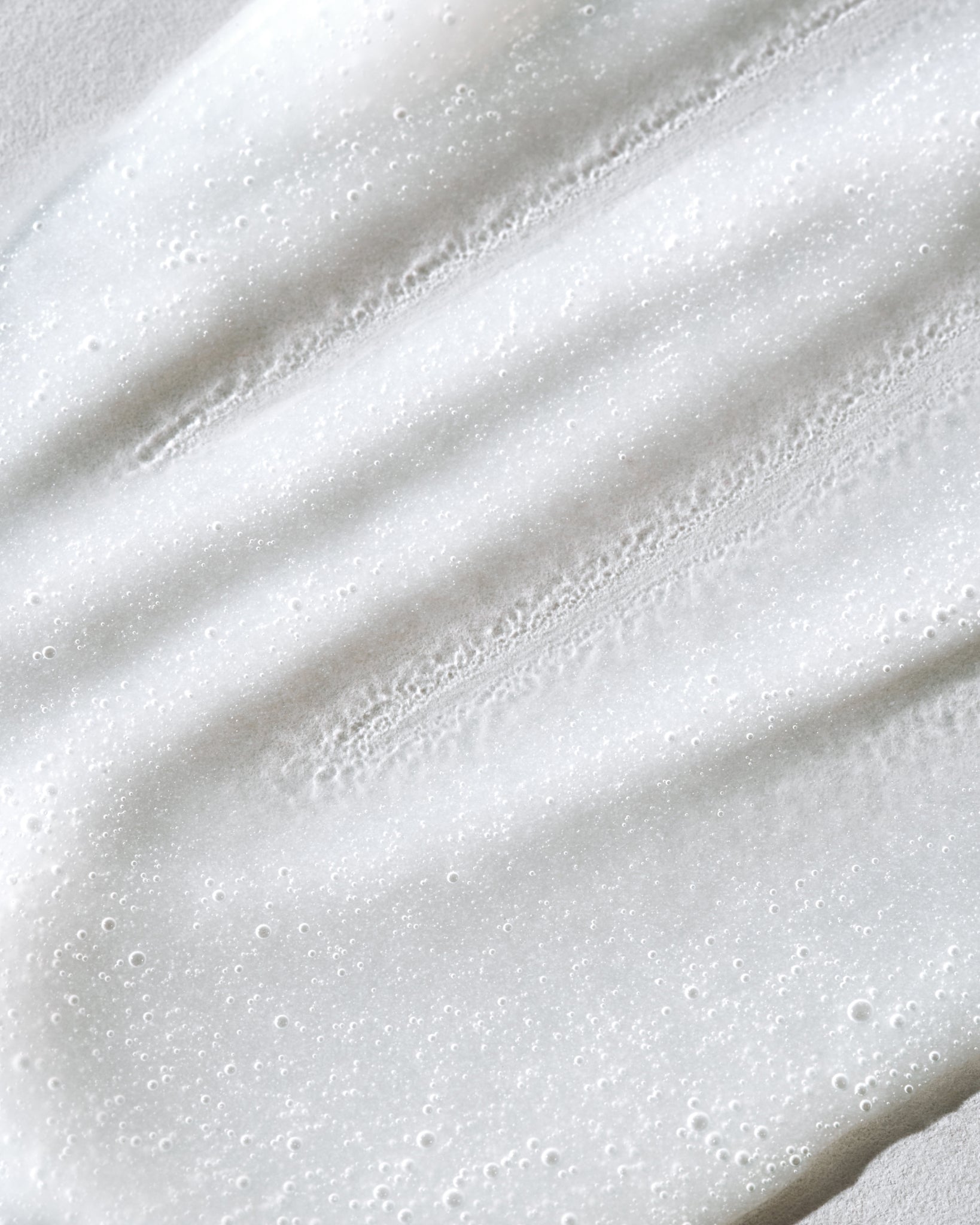 Texture close-up of MÁDARA Organic Skincare aha acid peel mask A2101 face mask �swatch demonstrates consistency and finish.