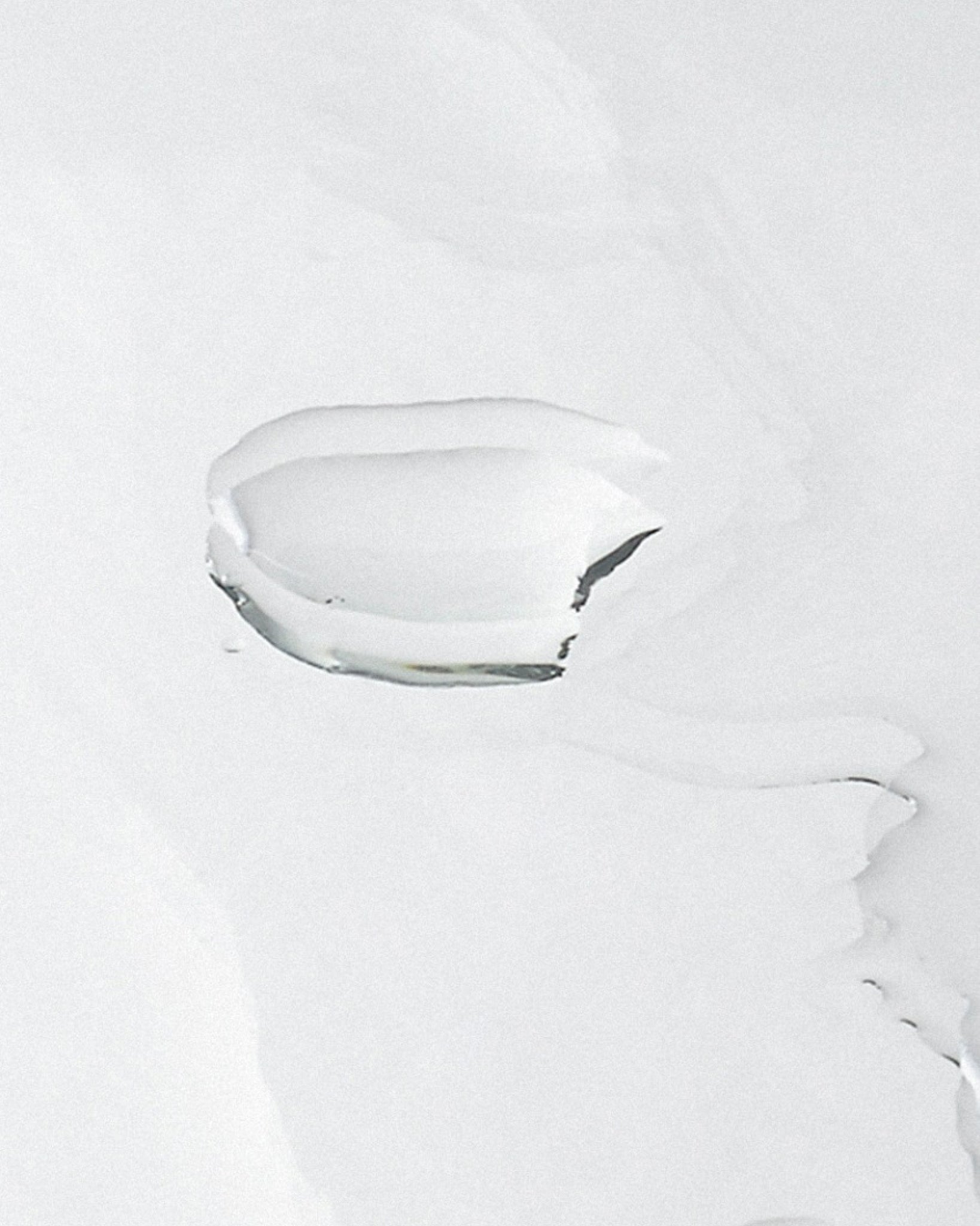 Model wearing MÁDARA Organic Skincare pore minimising face toner A2052 toner on skin; close-up portrait shows natural application results.