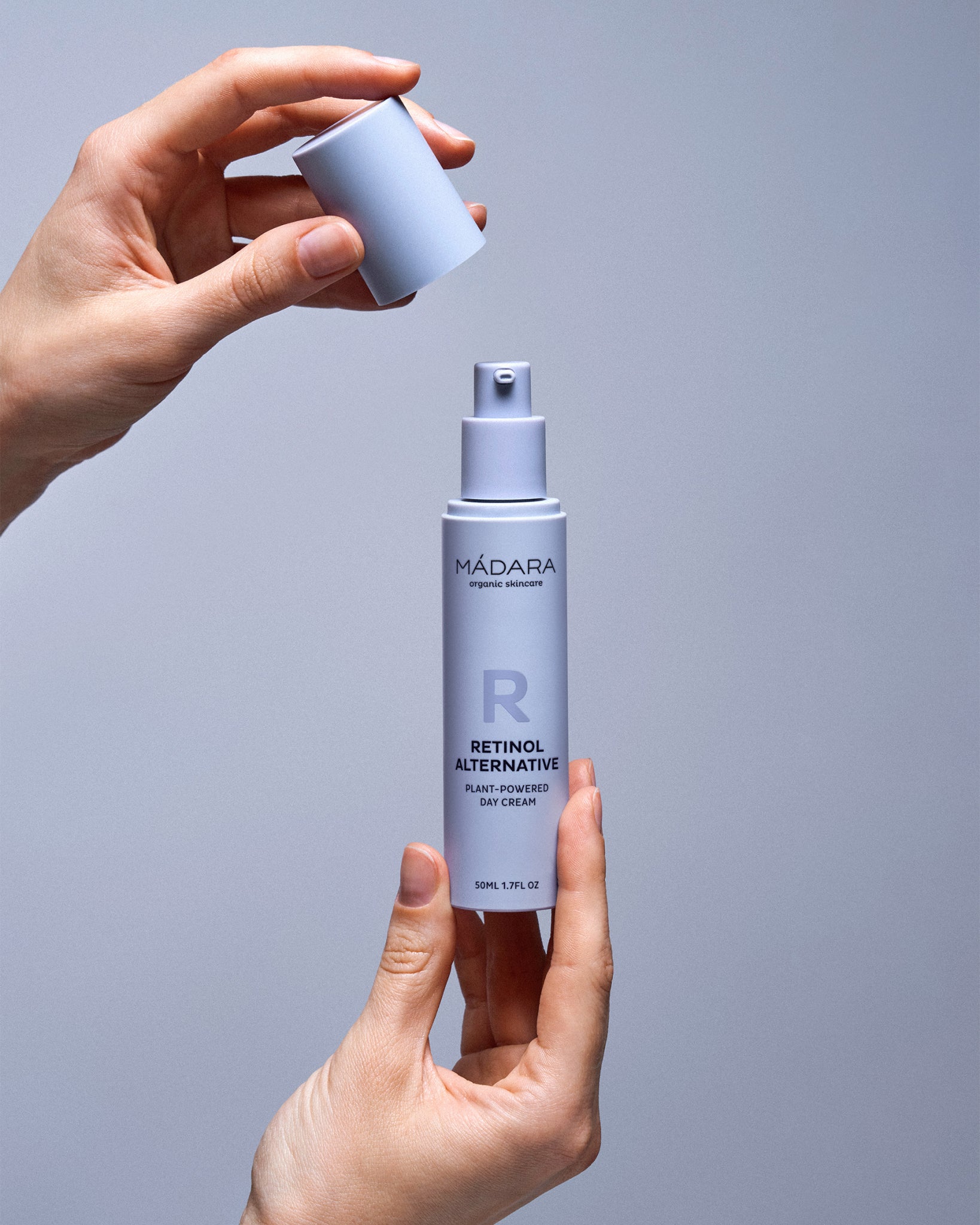 Model wearing MÁDARA Organic Skincare retinol alternative face moisturiser A3350 on skin; close-up portrait shows natural application results.